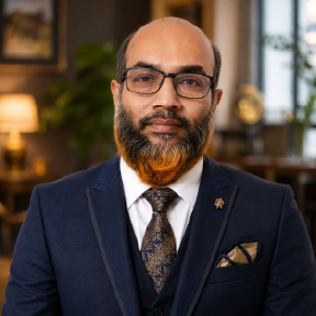mars shohag Executive portrait of the Founder and CEO of Golden Feather wearing a formal dark suit and tie