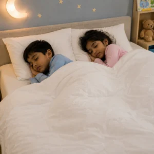 Premium Queen Size Feather Quilt Two children sleeping peacefully under a white 100% natural feather-filled quilt with matching feather pillows and mattress topper.